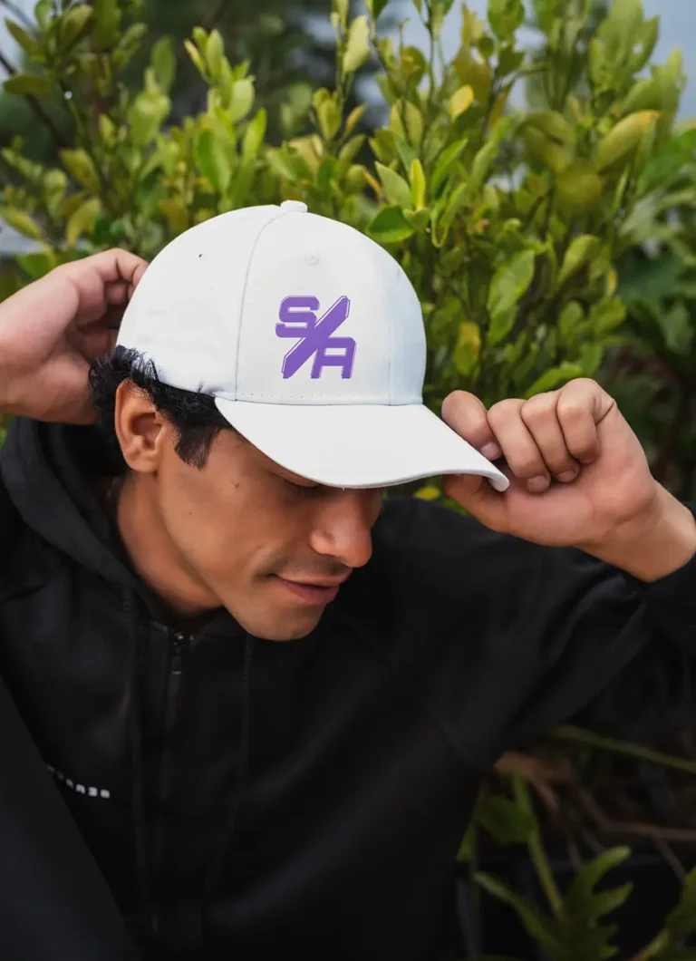 a white hat with a purple logo