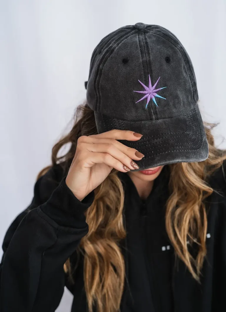 a Black hat with a purple logo